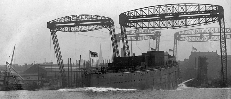 The iconic gantry cranes at the launch of HMS HERCULES in 1910, Palmers Yard,